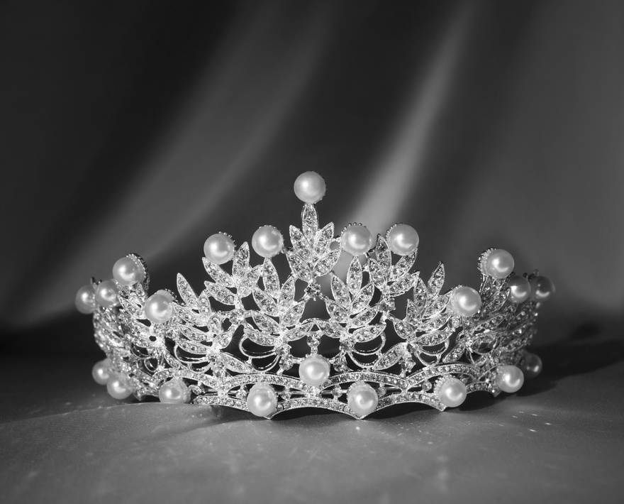 Luxury crown with pearls and jems and diamonds. Black and white photo, monochrome.
